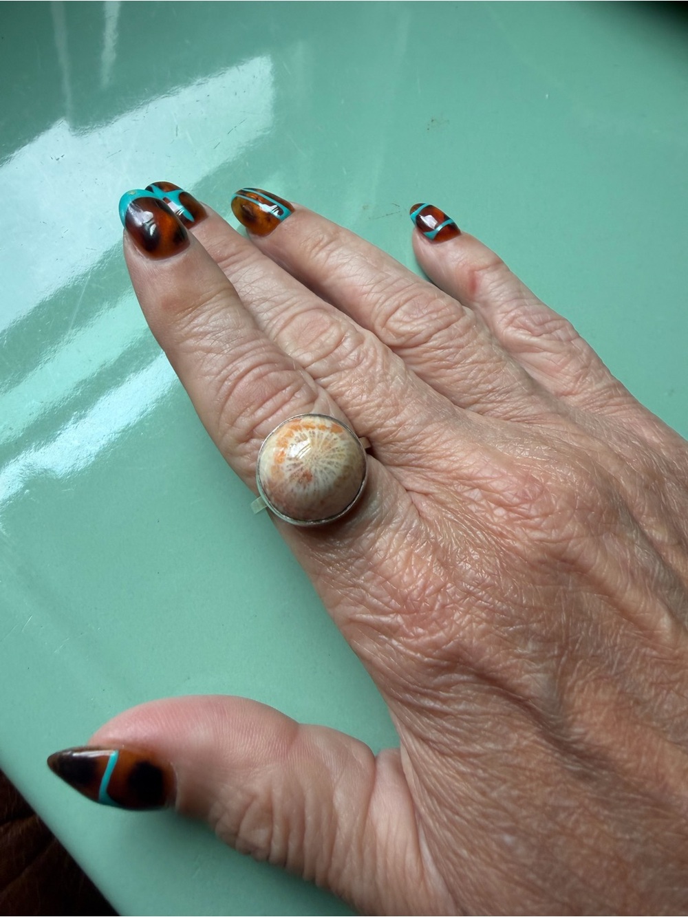 Sterling and fossilized coral ring